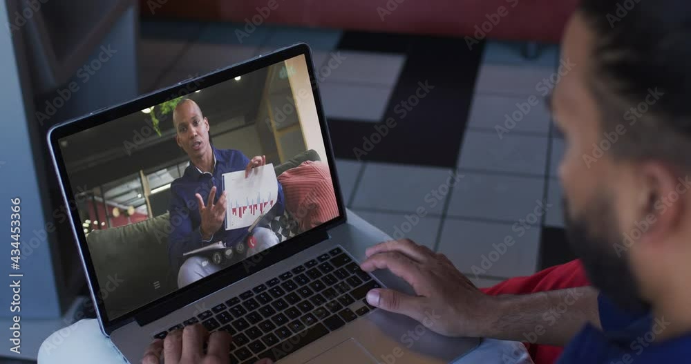 African american man having a video call with male office colleague on laptop at home African american man having a video call with male office colleague on laptop at home