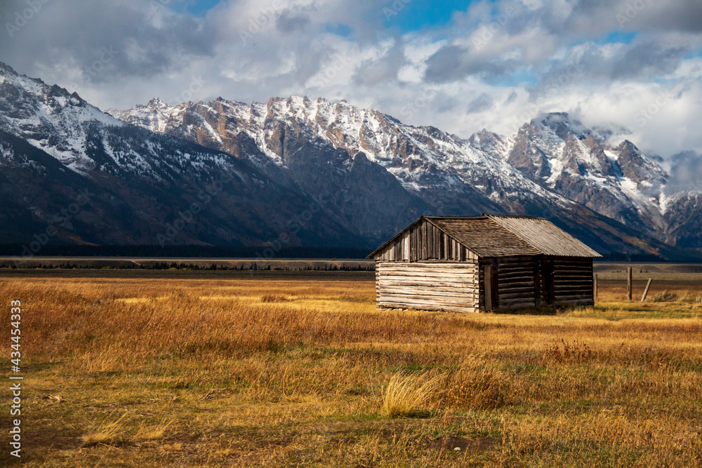 historic Moulton barns n Mormons' Row against the dramatic Teton mountain range  in Wyoming.