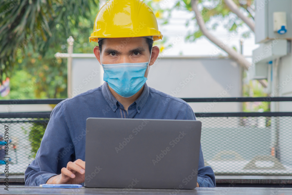 Engineer working on computer technology , Engineer wear medical mask