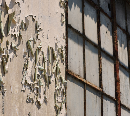 The remnants and empty shell of a once prosperous factory in southern New Jersey now sits empty and abandoned with broken windows photo