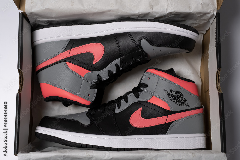 Prague, CZ - 16 May 2021: Air Jordan 1 Mid custom HOT PUNCH Pink Shadow.  Retro High sneaker in box top view unpacked received. Editorial Stock Photo  | Adobe Stock