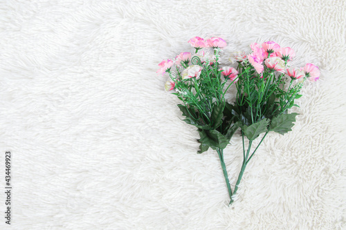 bouquet of flower on white artificial wool background