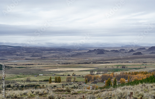 distant valley with mountains and large meadows for agriculture