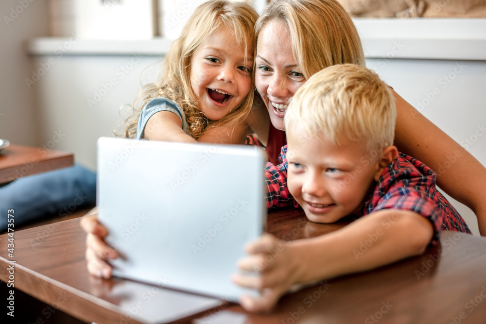 Mom watching an online video with her kids Mom watching an online video with her kids
