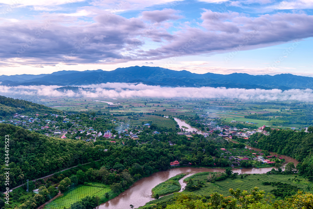 Aerial View of Tha Ton city in the valley with kok rivers, people houses and Temple Chiang Mai province Thailand.