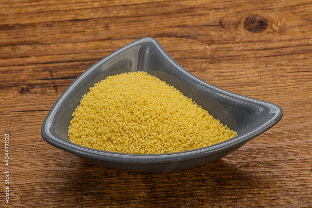 Raw cous cous heap in the bowl Raw cous cous heap in the bowl