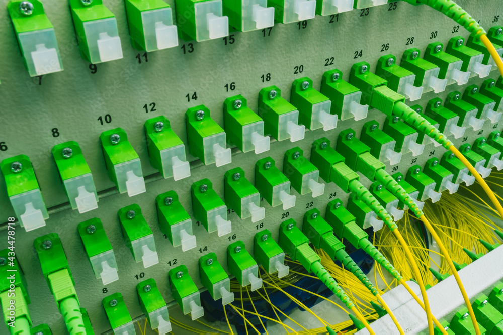 Fototapeta premium Optical distribution panel with optic patch cord cables, gigabit passive optical networks