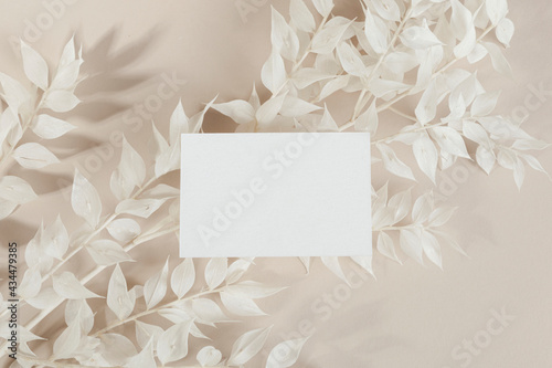 Business card on ornamental branches mockup