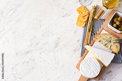 Board with tasty cheese, sn...