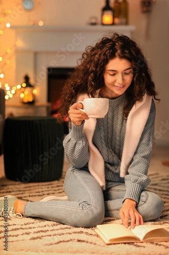 Beautiful woman drinking te...