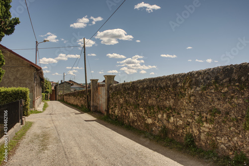 Tableau sur toile a long wall on the street in angera a town on lago maggiore, hdr image