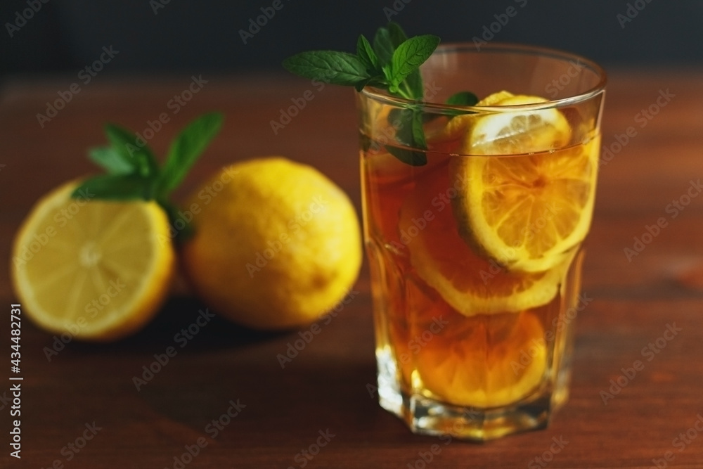 Fototapeta premium Traditional iced tea with lemon and ice in tall glasses. Summer drink