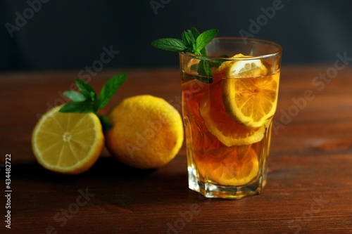 Cold tea with lemon and mint. . A summer drink