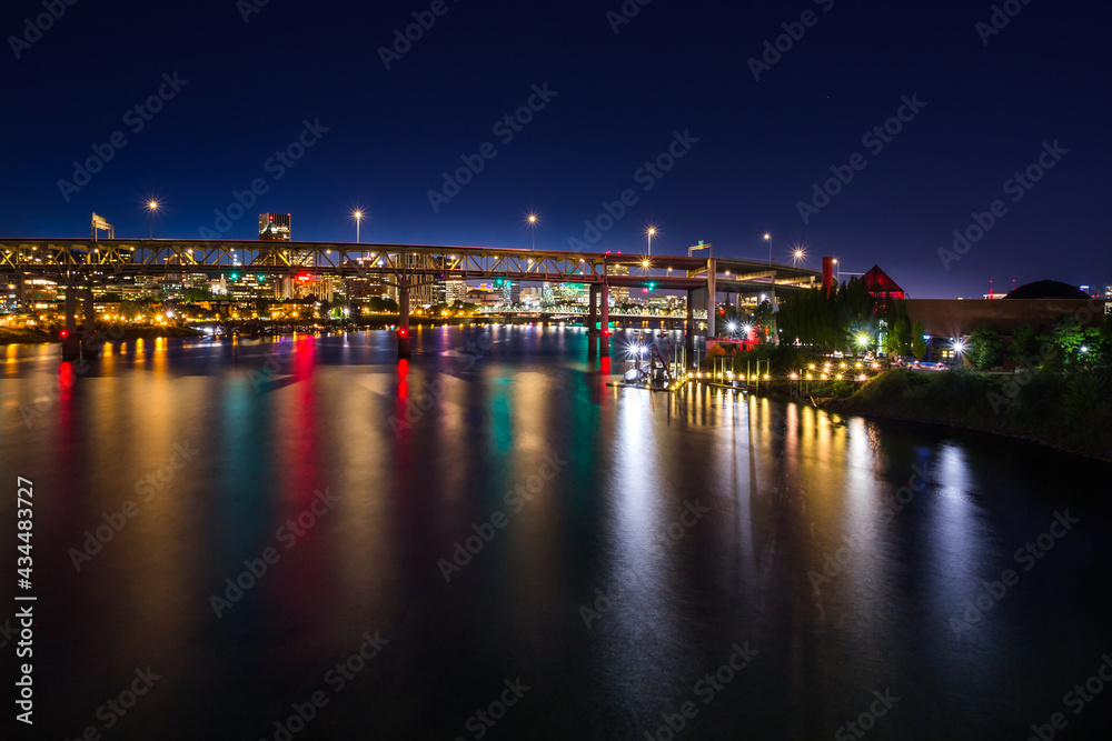 Colorful cityscape of Portland over Willamette  river at dusk