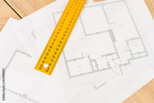 Architect working on blueprint. Architects workplace - architectural project, blueprints, ruler, calculator, laptop and divider compass. Construction concept. Engineering tools