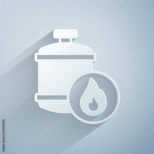 Paper cut Propane gas tank icon isolated on grey background. Flammable gas tank icon. Paper art style. Vector