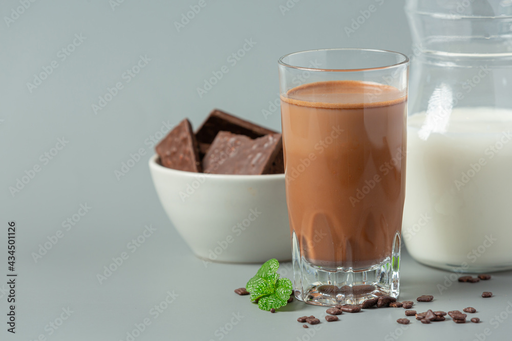 Glass of chocolate milk on the dark background. Glass of chocolate milk on the dark background.