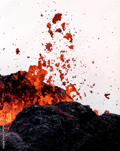 Close-up of fresh lava flowing from volcano eruption in Geldingadalur, Iceland. photo
