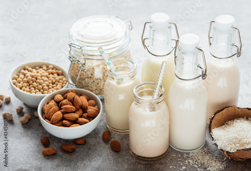 Alternative types of vegan milks in glass bottles