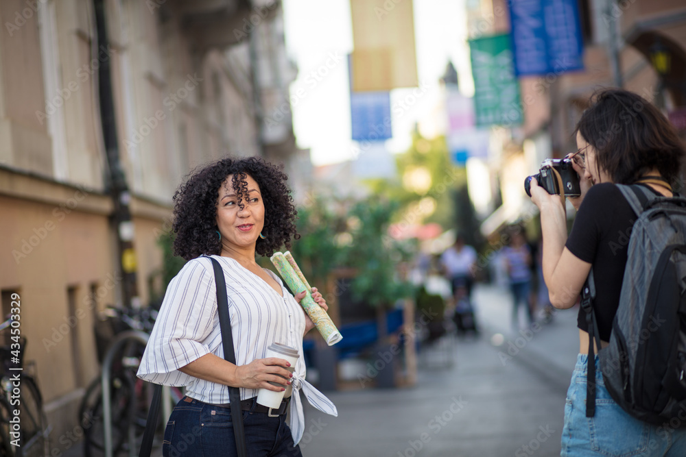 Fototapeta premium Two tourist women on street.
