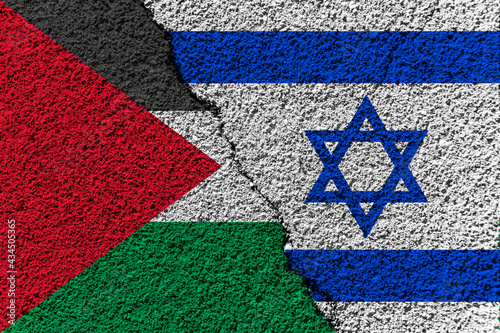 Concept of a Conflict between Israel and the Palestinian National Authority with painted flags on a wall with a crack