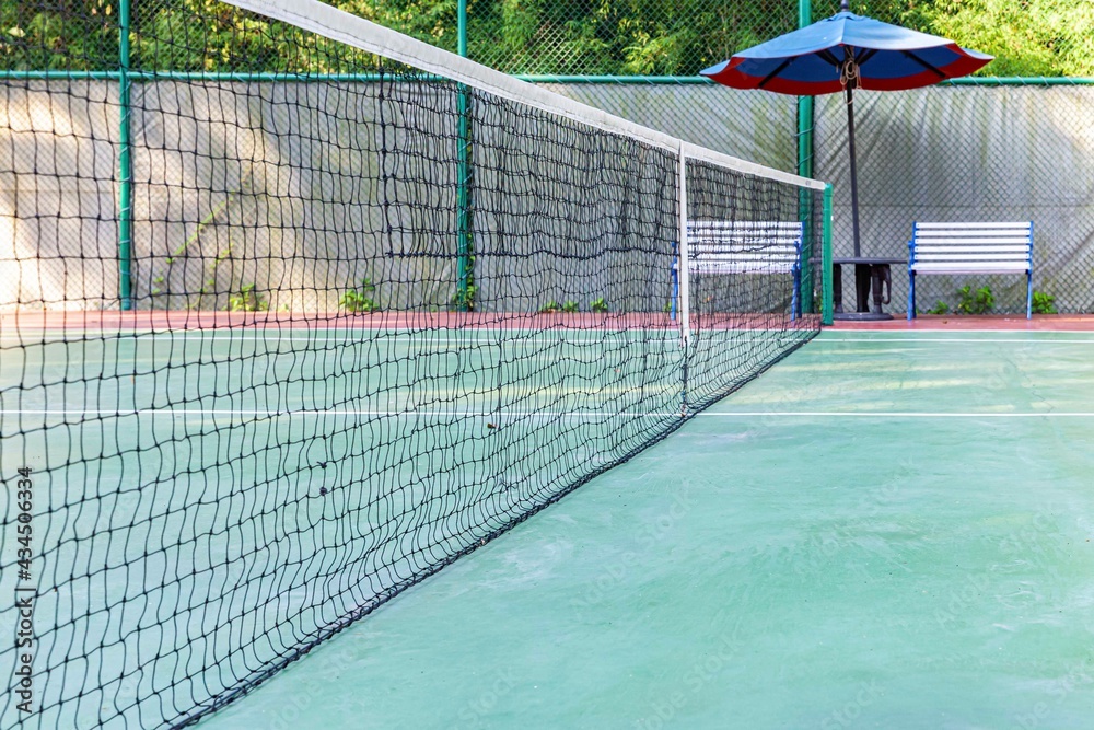Black plastic net on the tennis court