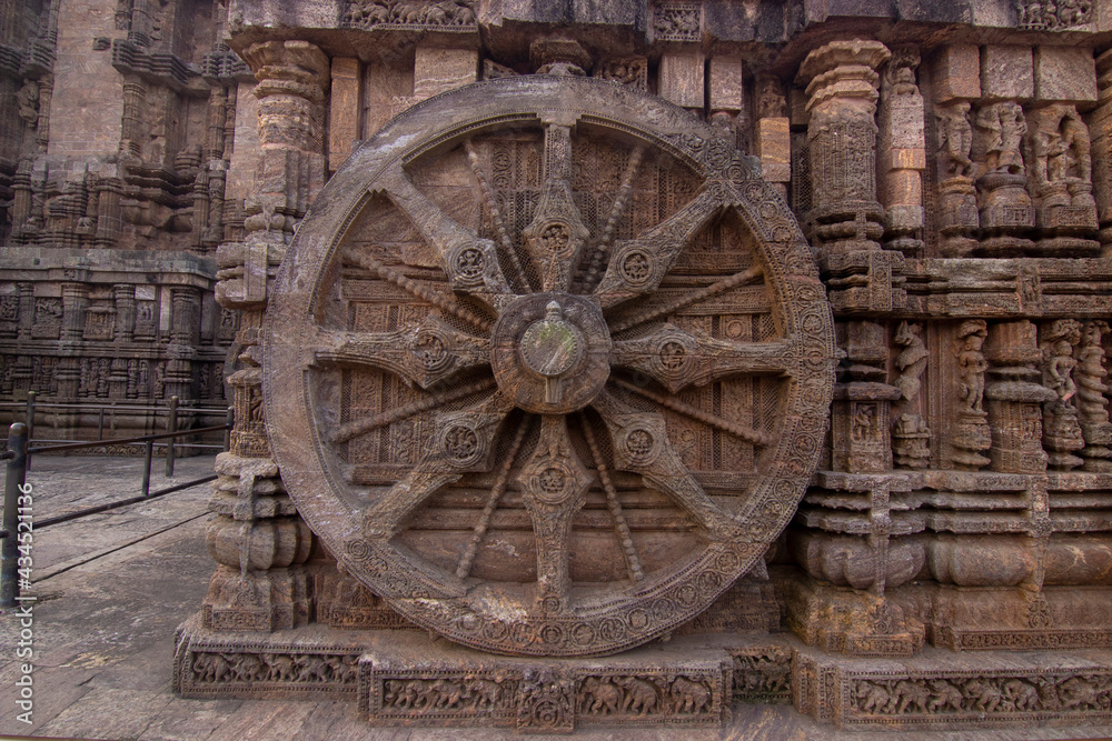 A chariot wheel carved into the wall of the 13th century Konark Sun Temple, Odisha, India.