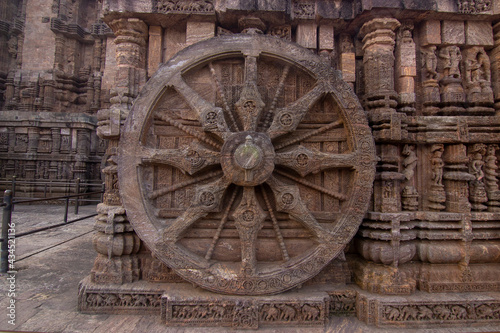 A chariot wheel carved into the wall of the 13th century Konark Sun Temple, Odisha, India.