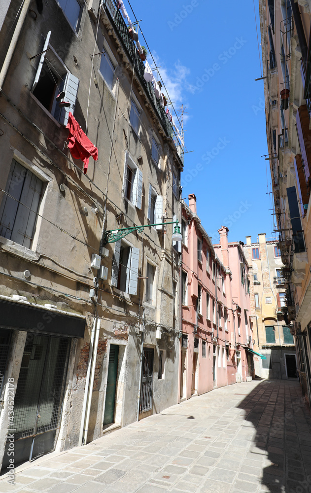glimpse of the city of Venice with the narrow alley that in Venetian Italian is called calle