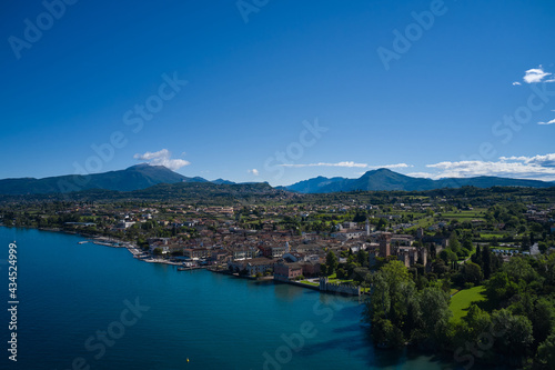 Lazise Lake Garda Italy. Panorama of the historic town of Lazise. Aerial view of the Scaliger Castle of Lazise. Top view of the historic part of the city Lazise Castle on the coastline of Lake Garda. © Berg