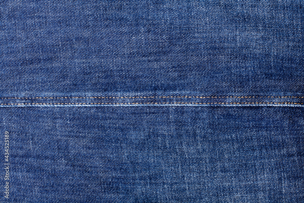 Blue jeans texture and seam closeup, thread stitch line, jean textile background, dark blue denim backdrop, jeans pattern, indigo jeans cloth, grunge fabric wallpaper, rough material, empty copy space Blue jeans texture and seam closeup, thread stitch line, jean textile background, dark blue denim backdrop, jeans pattern, indigo jeans cloth, grunge fabric wallpaper, rough material, empty copy space