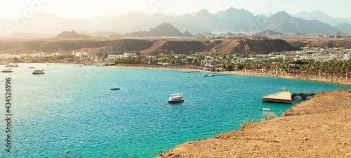 Panorama of Sharm el-Sheikh, Sharm El Maya bay. Red sea and Sinai mountains on a background. Tours to Egypt, travel and tourism concept.