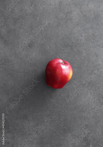 Red apple on concrete background