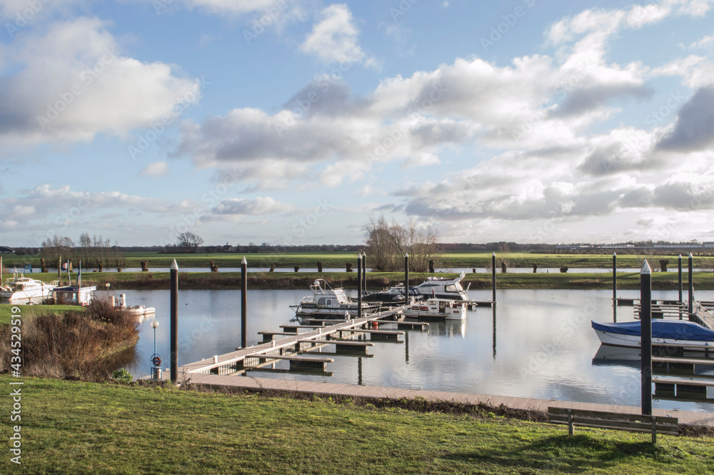 marina with motorboats and yachts on a winter's day