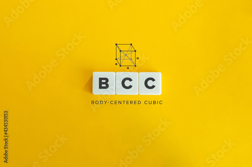 Body Centered Cubic (BCC) Crystal Structure Banner and Concept. Block letters on bright orange background. Minimal aesthetics. photo