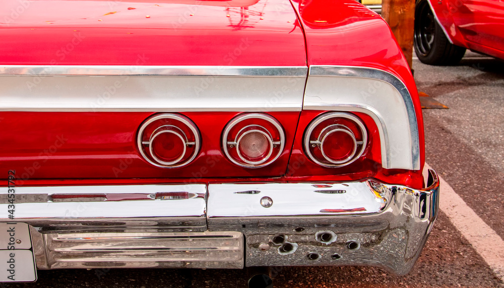Naklejka premium Classical American Vintage car 1964. Detail of back lights car view