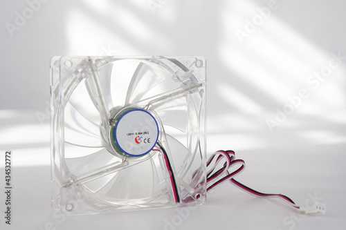 Computer fan made of transparent plastic on a light background