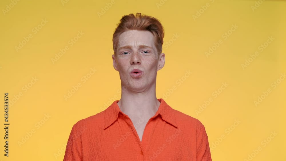 Young man with red hair expressing wow emotion Young man with red hair expressing wow emotion