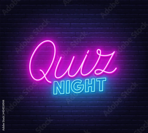 Quiz Night neon sign on brick wall background.