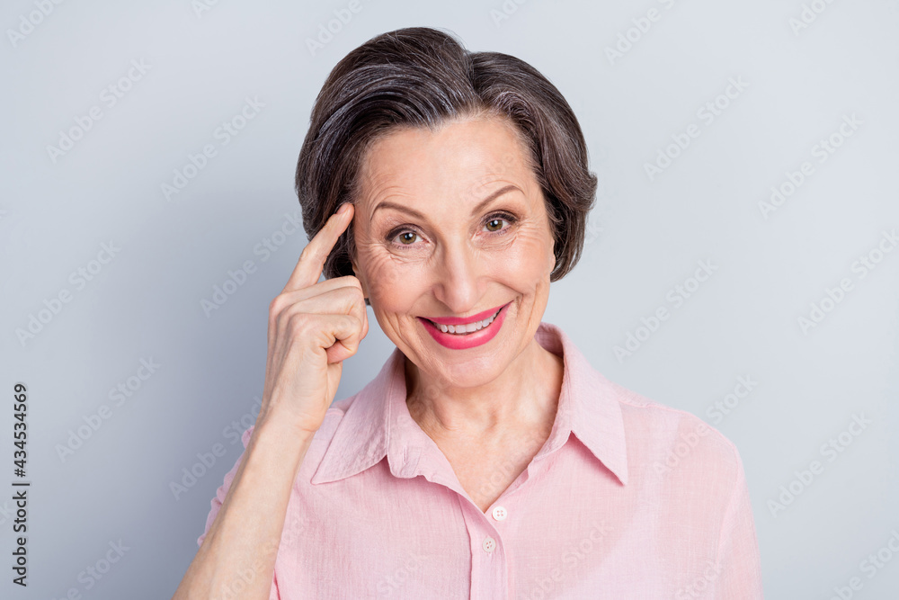 Close-up portrait of attractive cheerful woman specialist thinking touching forehead isolated over gray pastel color background Close-up portrait of attractive cheerful woman specialist thinking touching forehead isolated over gray pastel color background