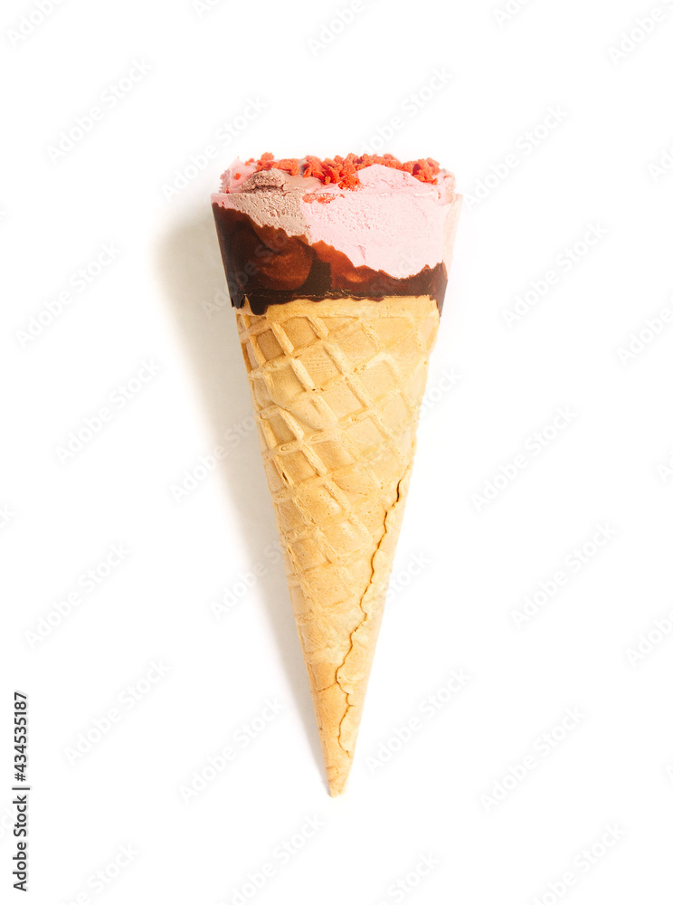 Ice cream cone close up. Pink ice cream scoop in a waffle cone on an isolated white background. Strawberry or raspberry flavor sweet dessert decorated with chocolate and colorful sprinkles, close up
Ice cream cone close up. Pink ice cream scoop in a waffle cone on an isolated white background. Strawberry or raspberry flavor sweet dessert decorated with chocolate and colorful sprinkles, close up
