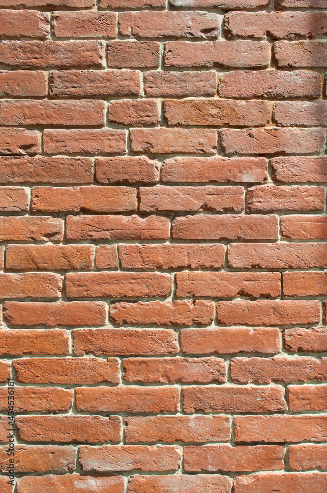 Old red brick walls. Old restored masonry. Historical and cultural heritage. Brick background. Old red brick walls. Old restored masonry. Historical and cultural heritage. Brick background.