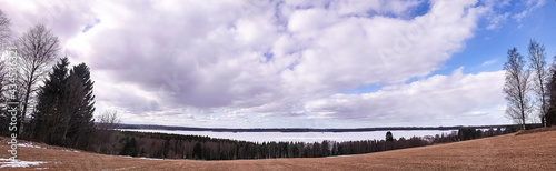 Large panorama of winter forest ice lake