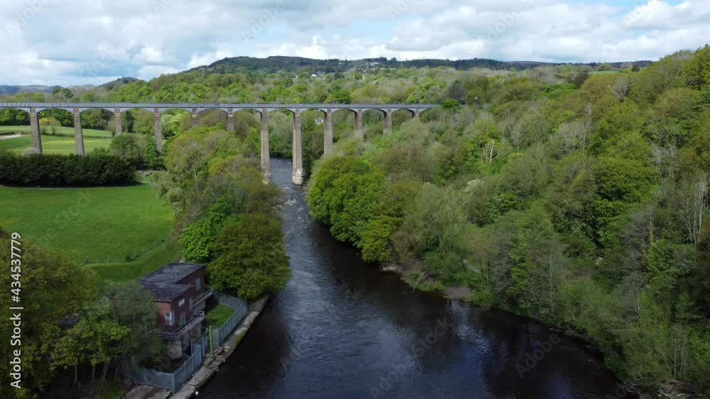Aerial view Pontcysyllte aqueduct and River Dee canal narrow boat bride in Chirk Welsh valley countryside high to low Aerial view Pontcysyllte aqueduct and River Dee canal narrow boat bride in Chirk Welsh valley countryside high to low