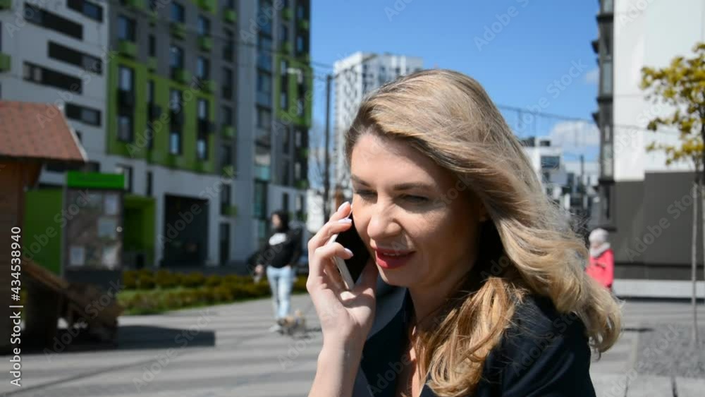 Sad beautiful cauccasian business woman talking on the phone Sad beautiful cauccasian business woman talking on the phone