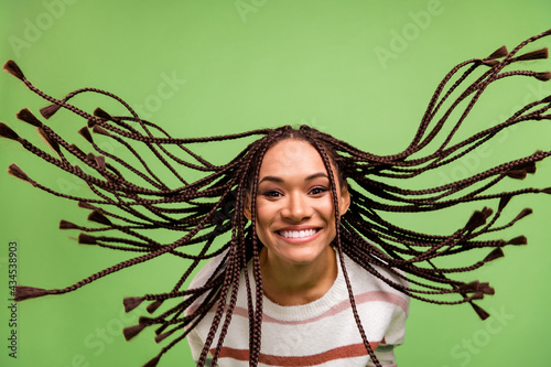 Canvas-taulu Photo of cheerful nice afro american young woman fly hair good mood smile isolat