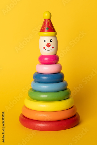 Fotografie Colourful kids stacking toy on coloured background