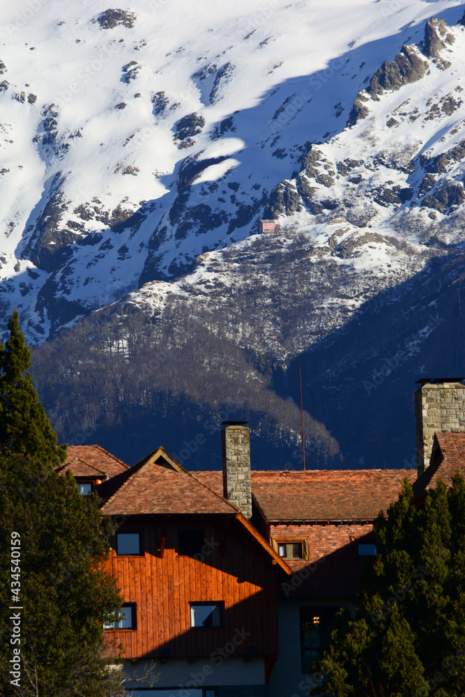 part of the llao llao hotel with snowy mountains in the background