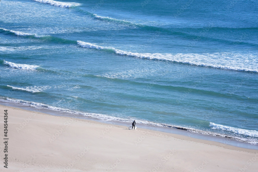 Surfer waiting on the Nemiña beach, in Atlantic Galician Coast, Spain.
