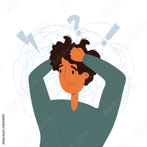 The young man grabbed his head because of the piled up problems. Exhausting rhythm of life, solution a lot of tasks.